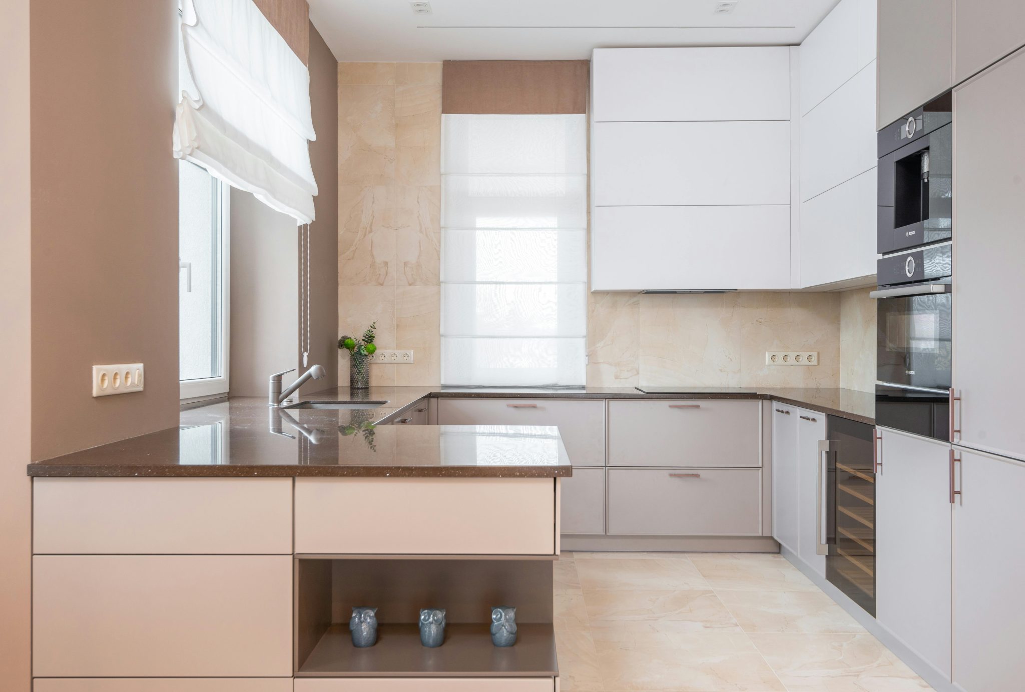 a light brown and white kitchen