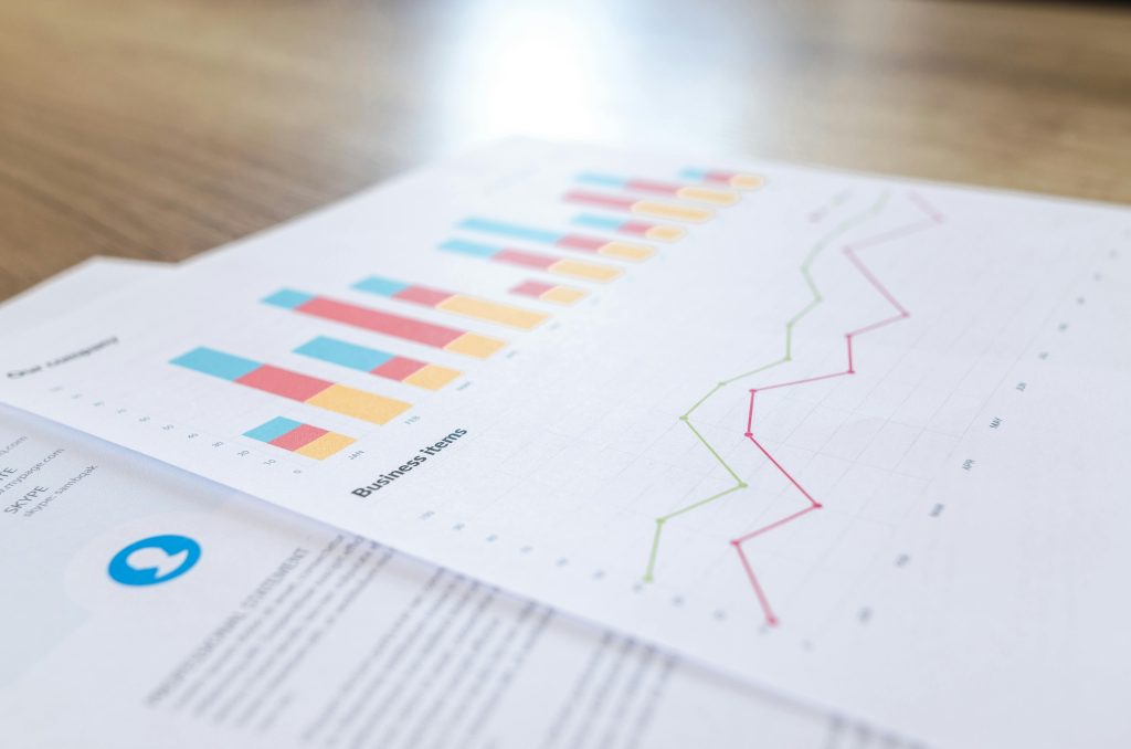 sheet of paper with bar and line graphs