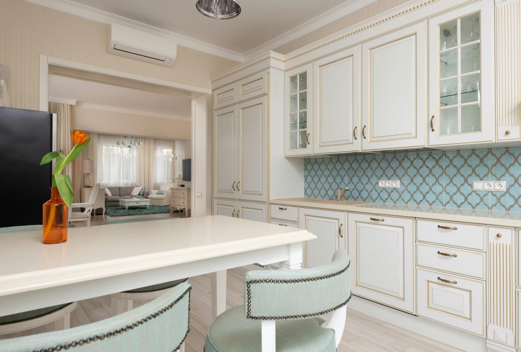white kitchen with blue tile details