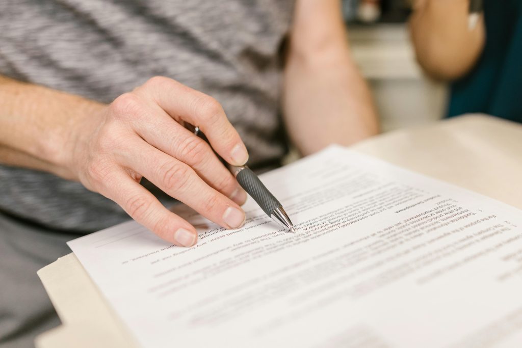 someone signing a contract