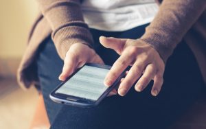 person scrolling on phone